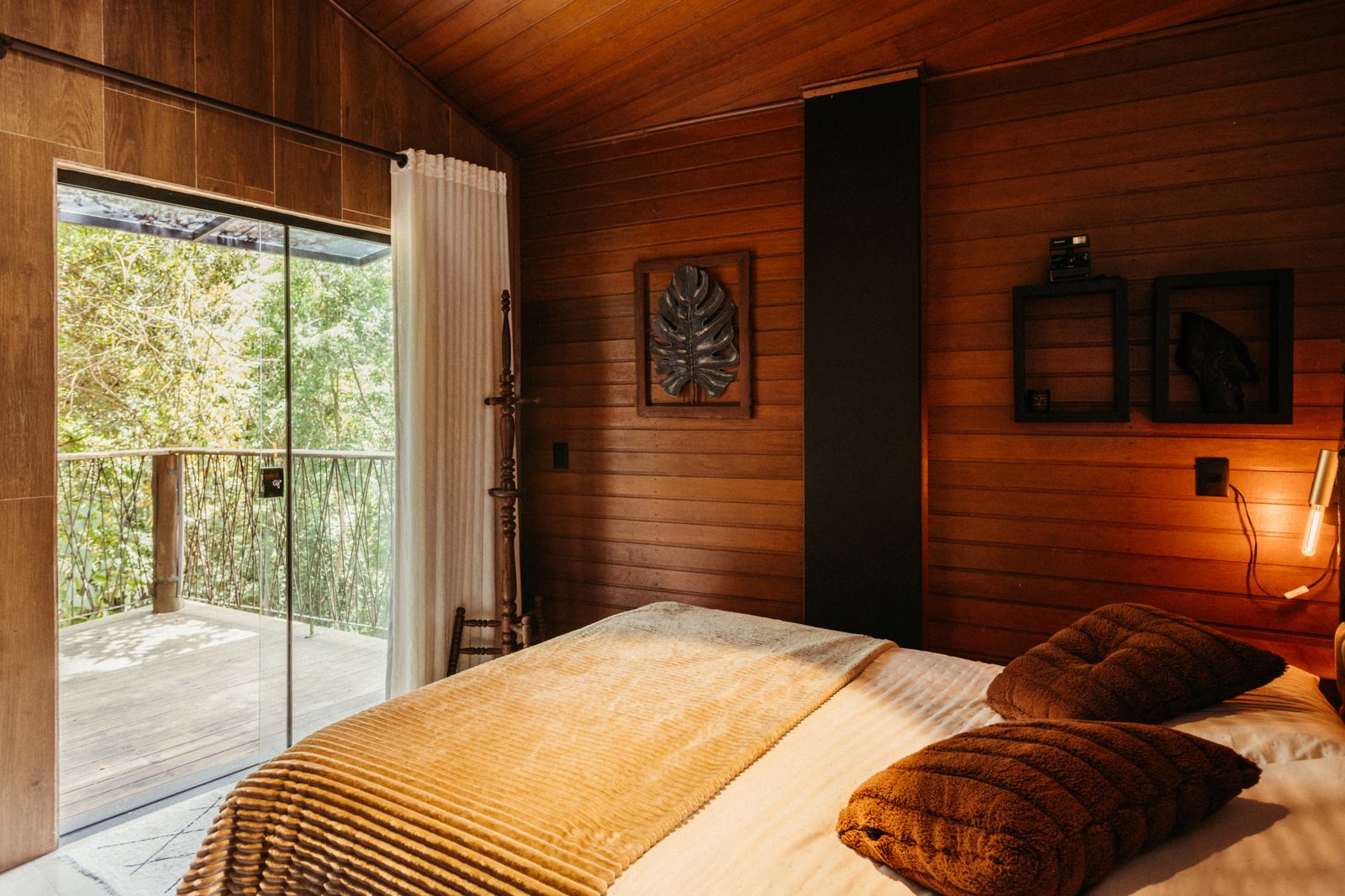 The Garret: a cosy top-floor bedroom under the eaves with a view of the treetops