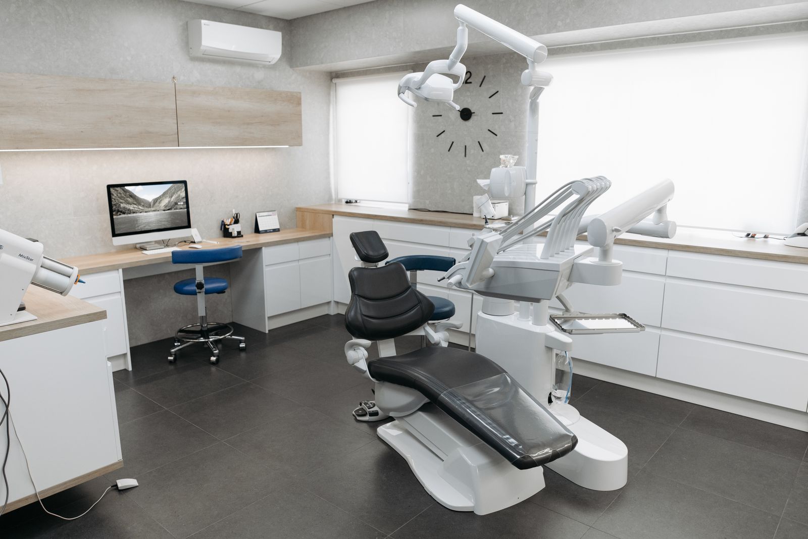 Modern dental equipment arranged neatly in a clean, well-lit clinic room