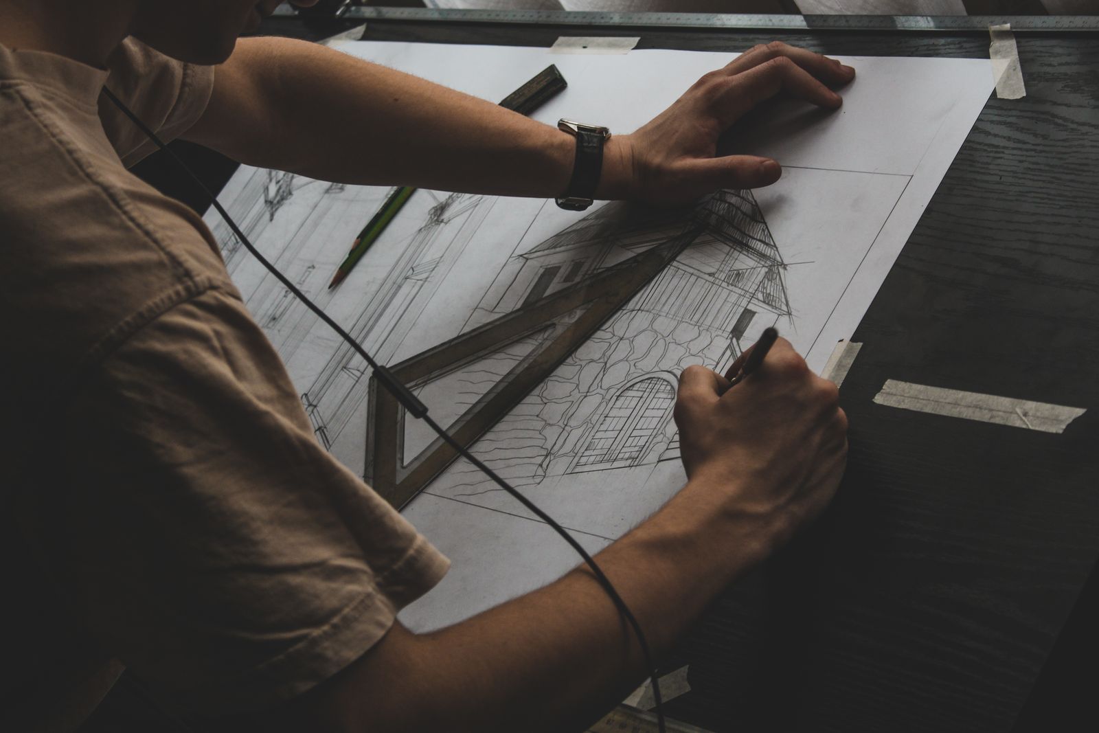 Close-up of hands working carefully over documents at a desk