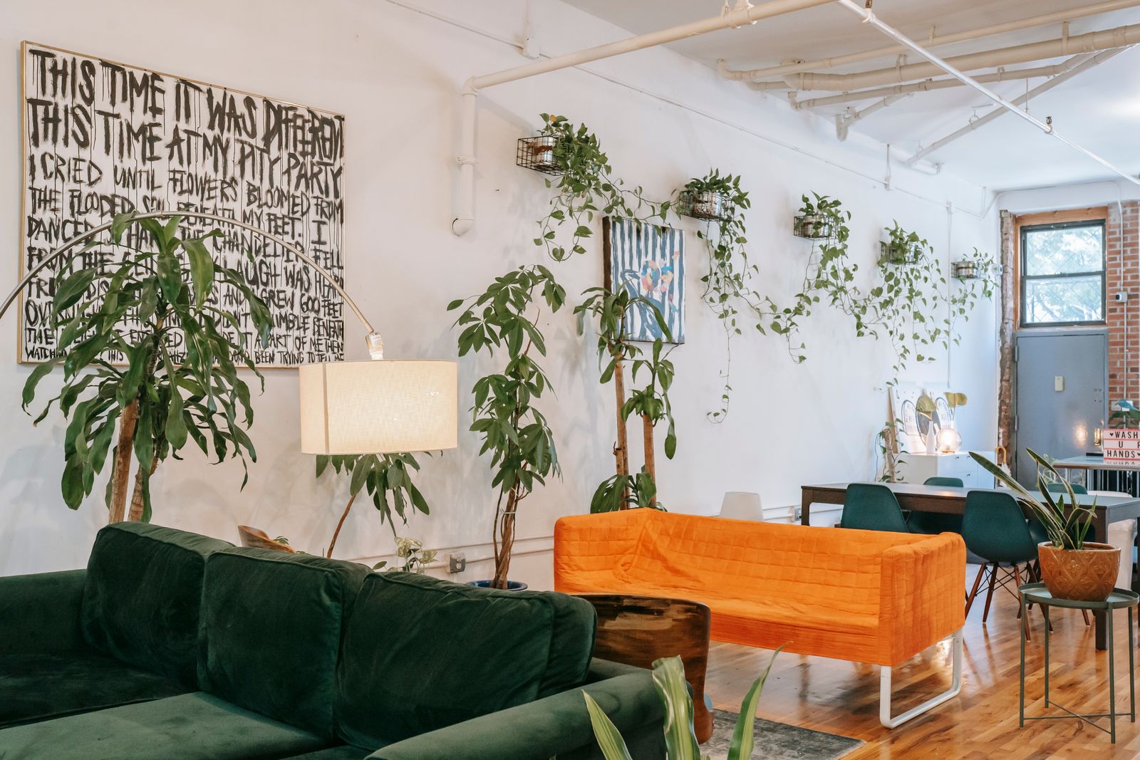 Bright living room interior with furniture and houseplants in natural light