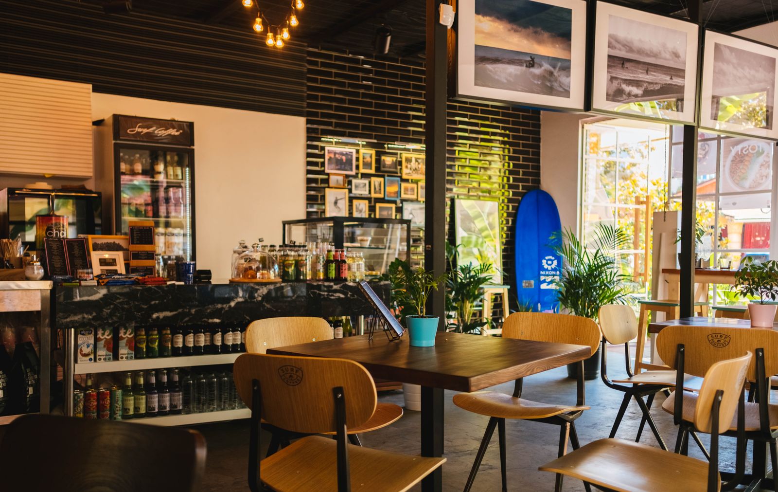 The dining room: cozy wooden tables and chairs set for service