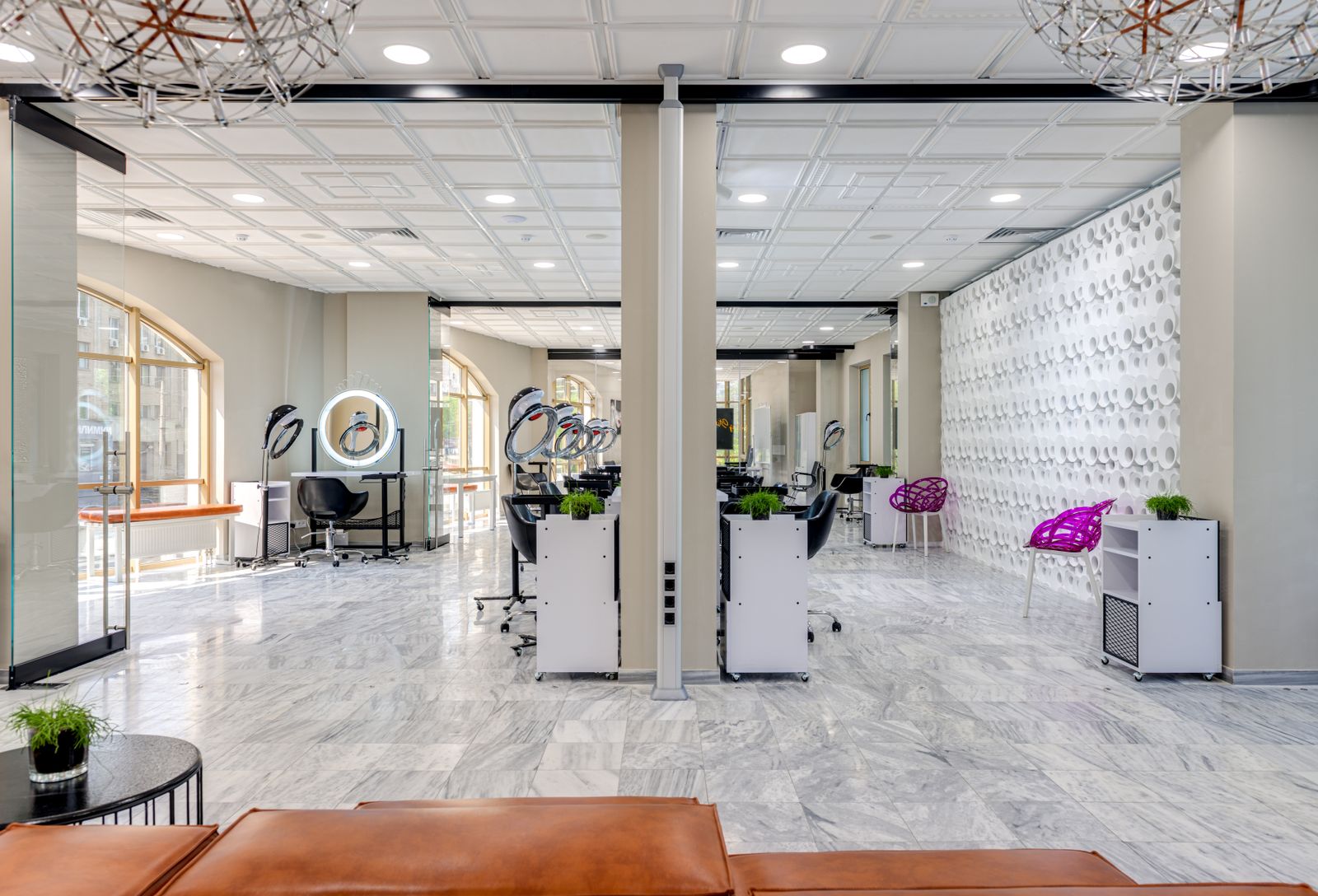 The shop floor: a classic barbershop interior with styling chairs and warm lighting